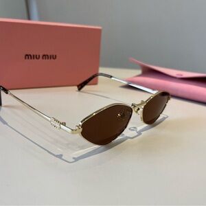 Miu Miu Elegant Gold Frame Sunglasses with Brown Lenses